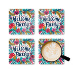 Colorful "Welcome To The Fuckery" coaster set with floral design and coffee cup.