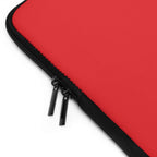 Red neoprene laptop sleeve with dual zipper and soft foam lining for protection