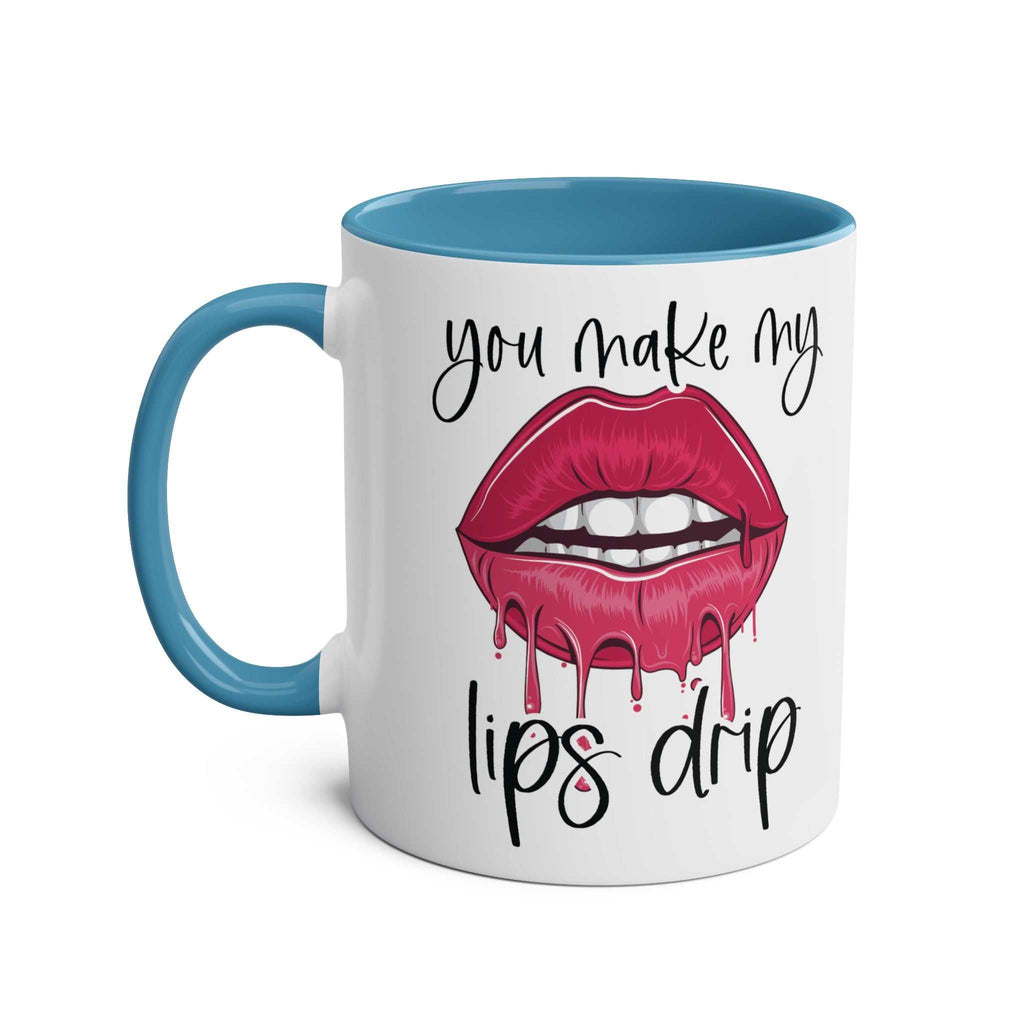 White ceramic "You Make My Lips Drip Fun Mug" with blue handle and inner rim featuring dripping lips design