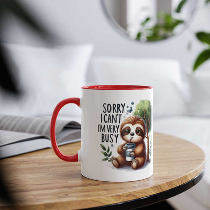 Cute sloth coffee mug with red handle, whimsical design, perfect for animal lovers.