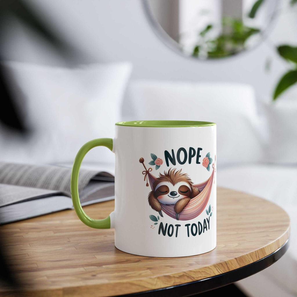 Cute sloth coffee mug with "Nope Not Today" design on a wooden table.