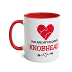 White ceramic "Favourite Knobhead Mug" with red handle and inside, Valentine’s Day design with heart and handshake graphic