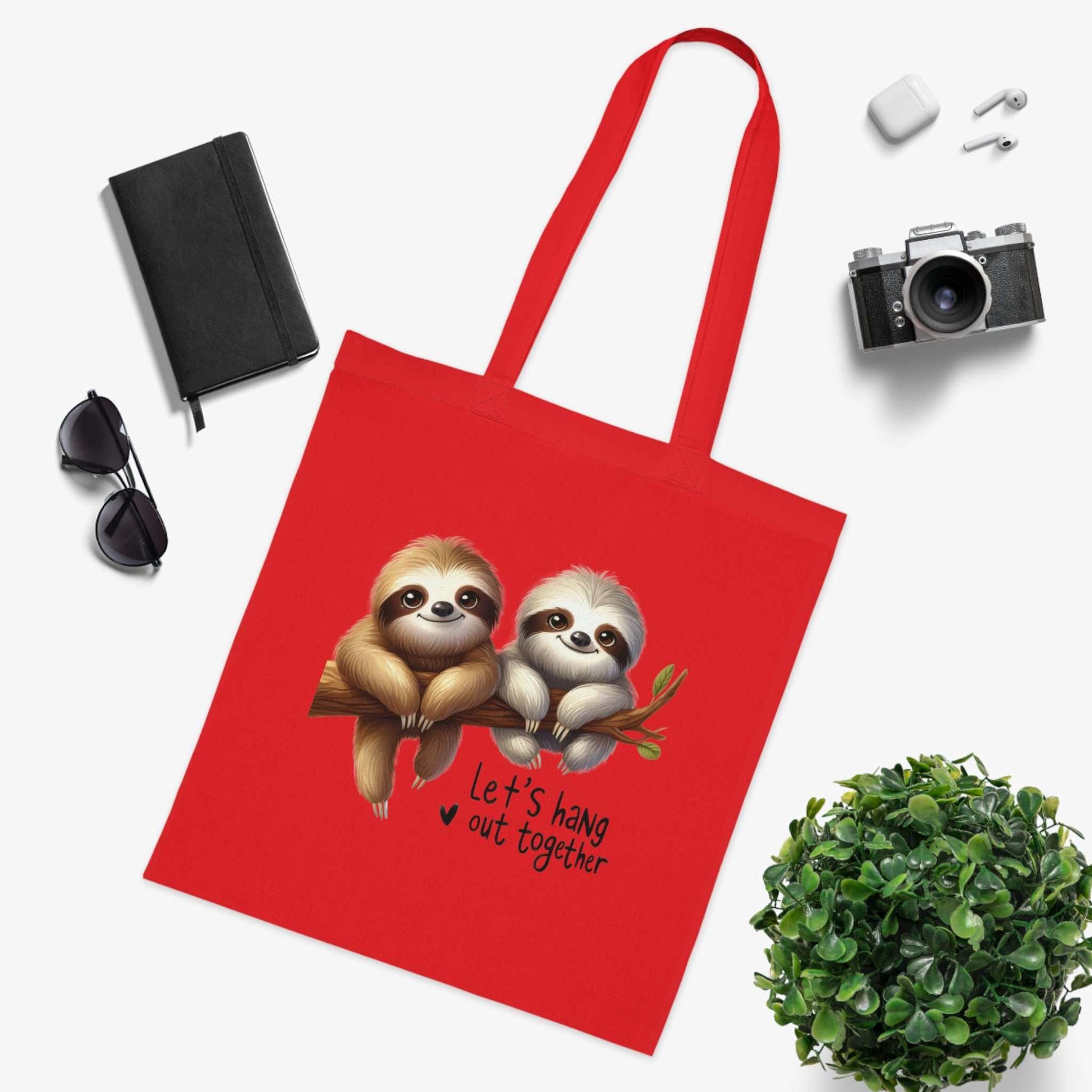 Cotton tote with cute sloth design; perfect for carrying essentials.