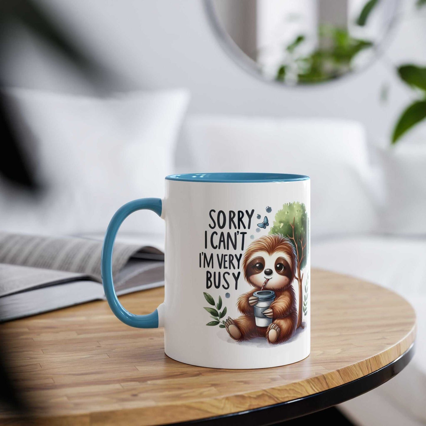 Cute sloth coffee mug with blue handle and text, perfect for animal lovers.