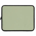 Sage green neoprene laptop sleeve with black trim, soft foam lining, dual zipper, lightweight and waterproof protection for laptops.