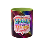 LGBTQ+ Pride mug with vibrant rainbow design, "Be Proud of Who You Are" text, 11oz ceramic, glossy finish.