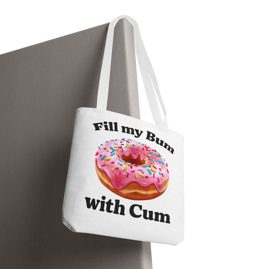 Provocative donut tote bag with cheeky design, durable spun polyester, multiple sizes and handle colors, perfect for errands and casual outings