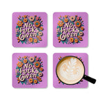 No Fucks Given coaster set with floral design, playful home accessory.