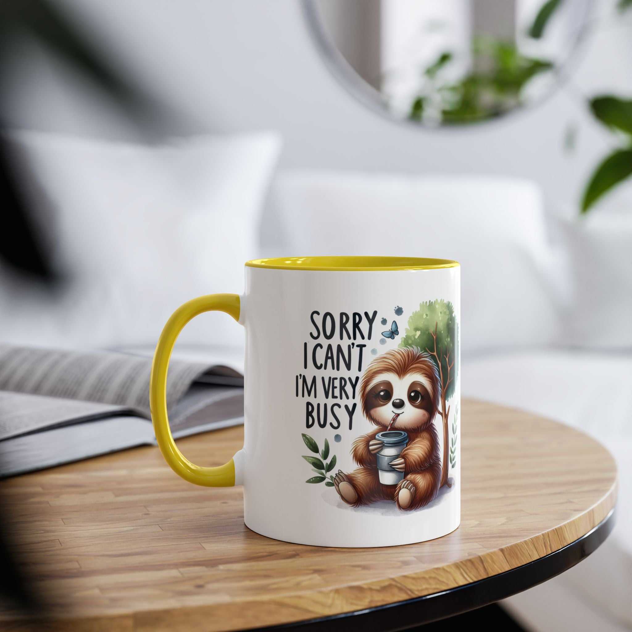 Cute sloth coffee mug with whimsical design and yellow interior on table.