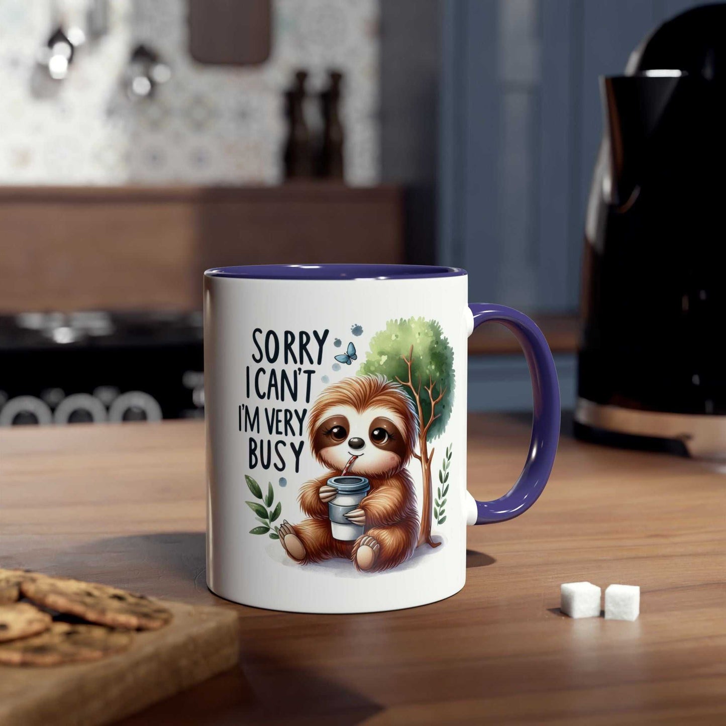 Cute sloth coffee mug with whimsical design and purple handle on a kitchen countertop.