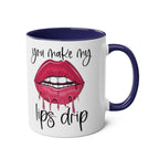 White ceramic "You Make My Lips Drip" fun mug with dripping lips design and blue handle and rim