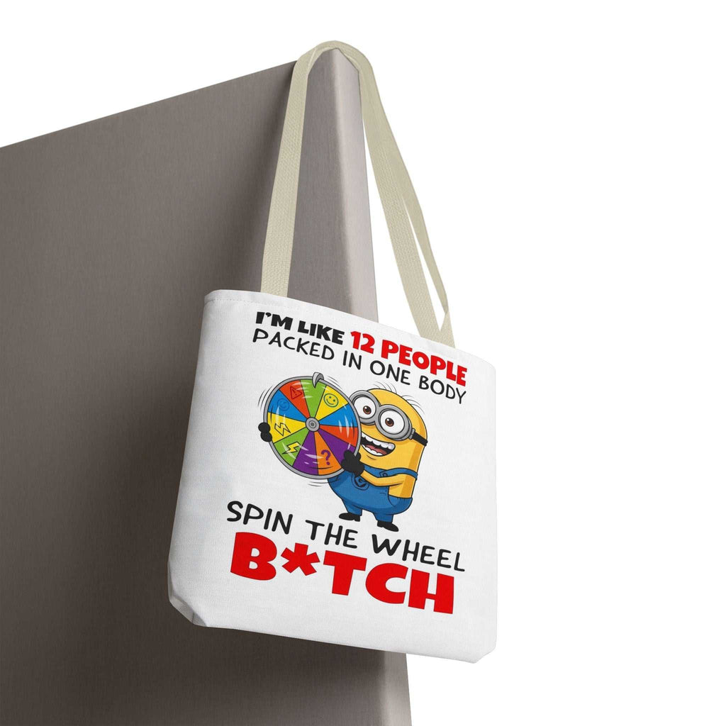Funny Minion tote bag with cheeky design and colorful handles, available in three sizes and made from durable polyester.