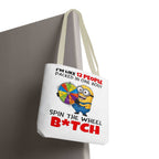 Funny Minion tote bag with cheeky design and colorful handles, available in three sizes and made from durable polyester.
