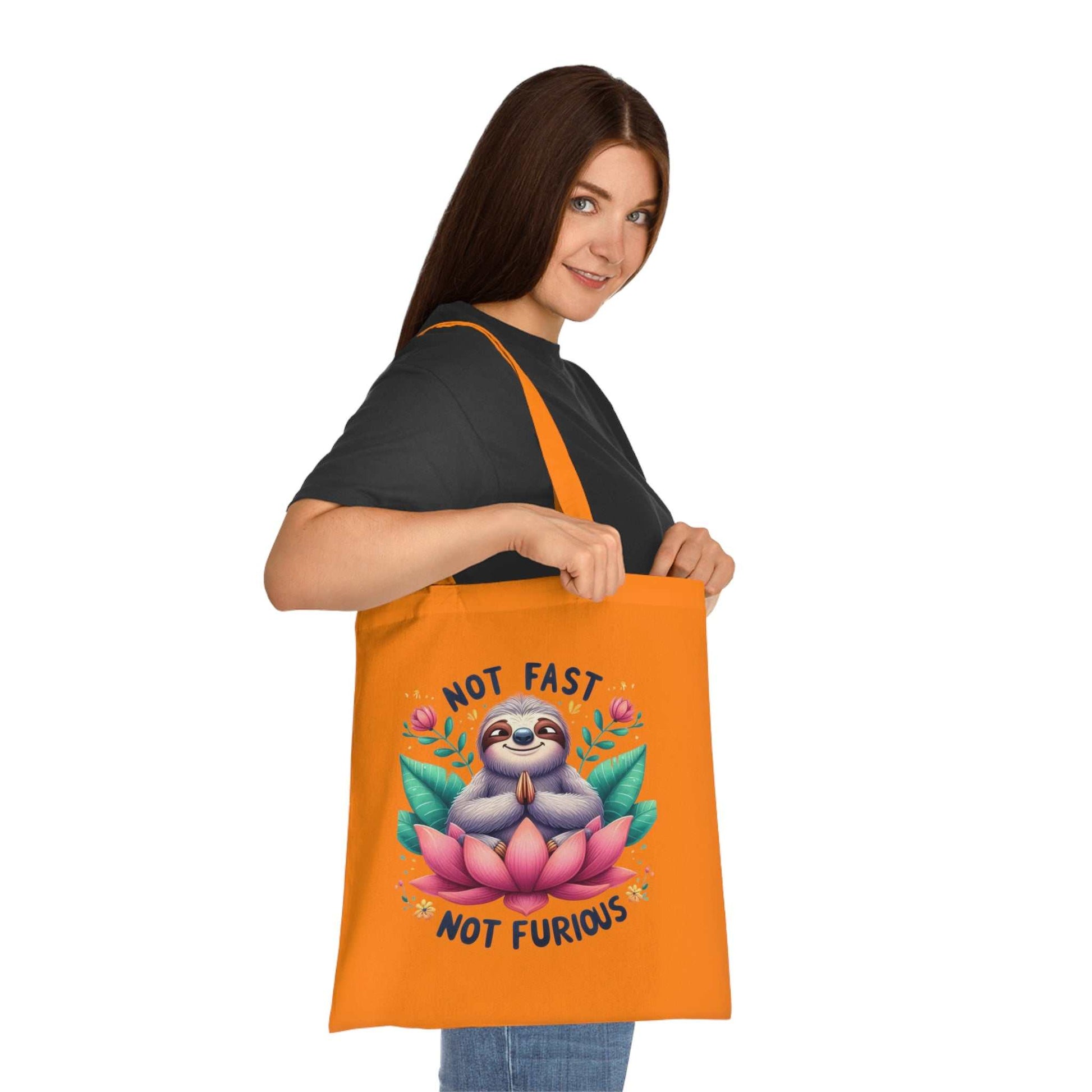 Cute sloth tote bag with vibrant colors, perfect cotton accessory for sloth lovers, featuring reinforced handles and durable design.