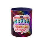 LGBTQ+ Pride Mug with rainbow design and "Be Proud of Who You Are" text.