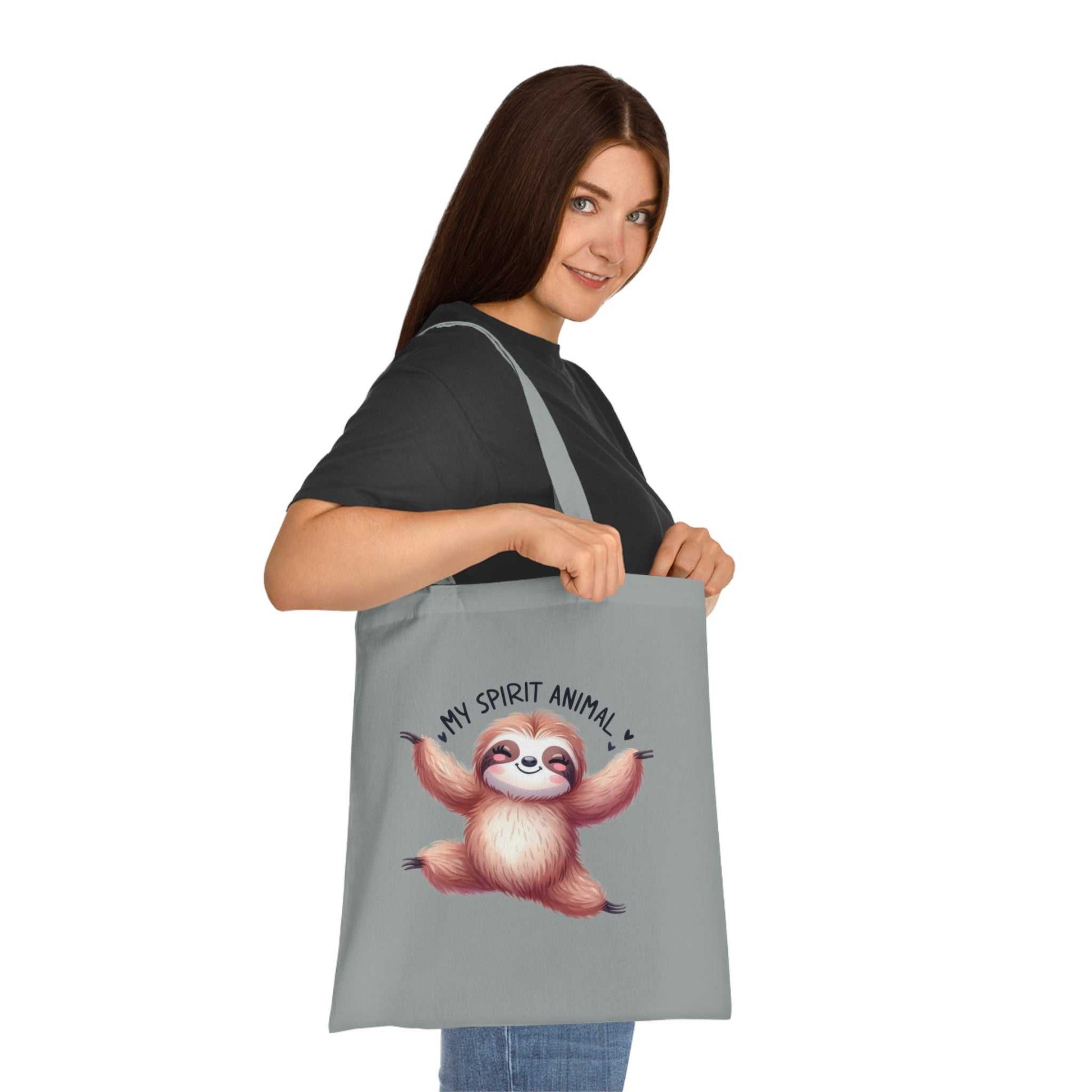 Cute sloth tote bag, cotton fabric, durable, vibrant design, perfect for gifts.