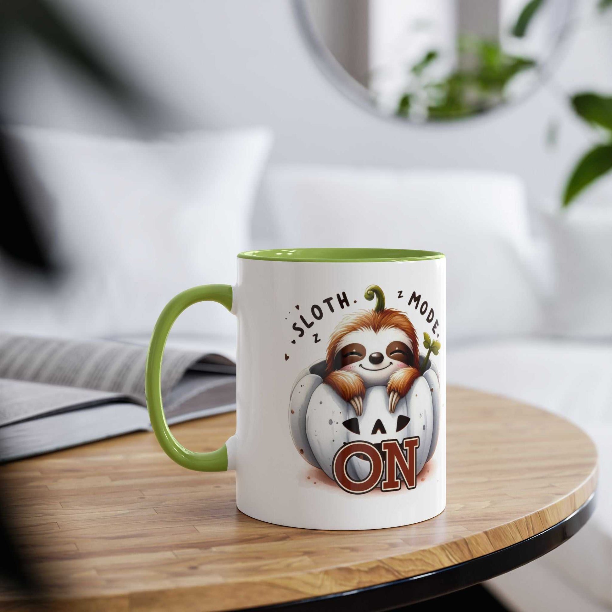 Cute sloth coffee mug with 'Sloth Mode On' design, glossy finish, on a wooden table.