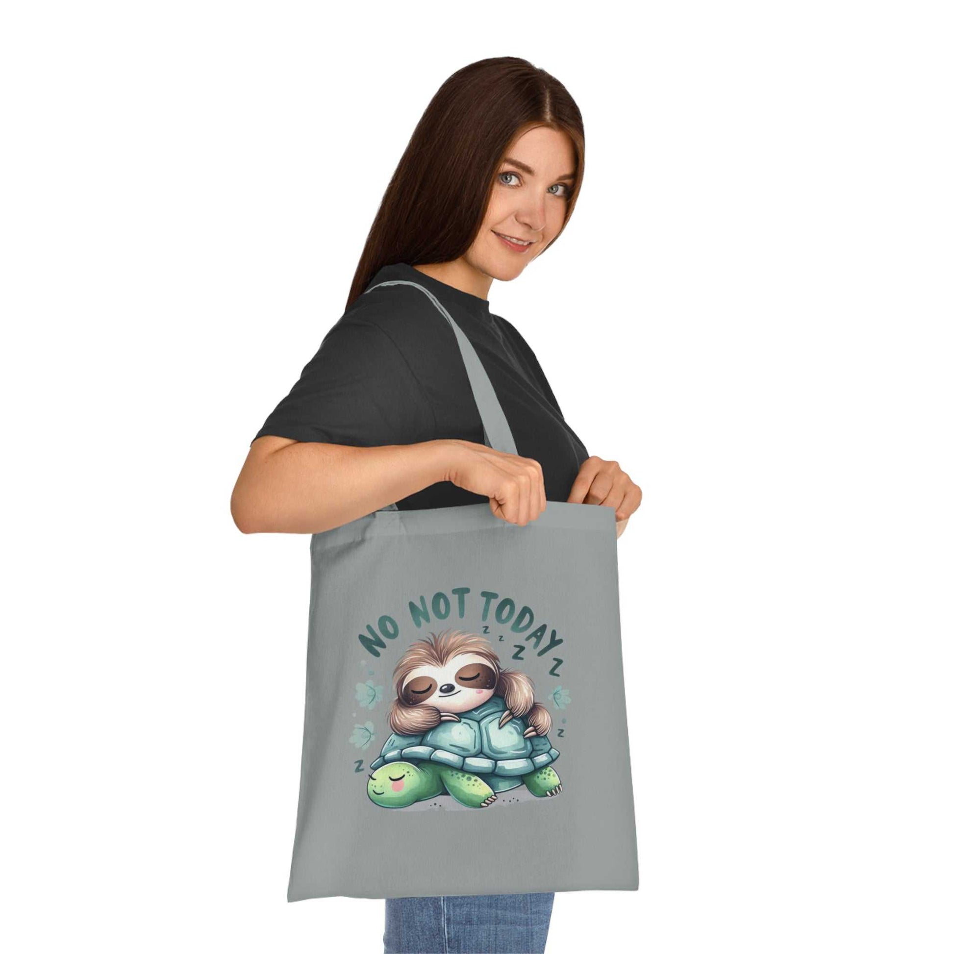 Cotton tote bag with cute sloth design, perfect for errands or gifting.