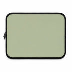 Sage green neoprene laptop sleeve with black trim, soft foam lining, dual zipper, lightweight waterproof design for 13-17 inch laptops