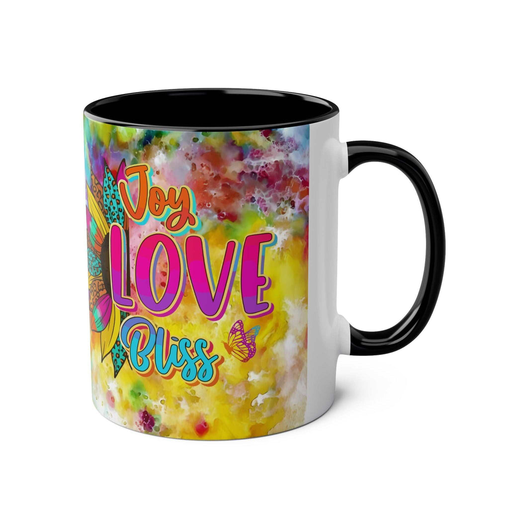 LGBTQ+ Pride mug with rainbow design, vibrant colors, and "Joy Love Bliss" text, ceramic, glossy finish.