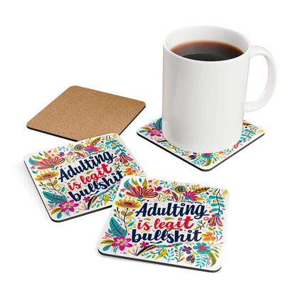 Adulting Is Legit Bullshit coaster set with colorful floral design and coffee mug on top.