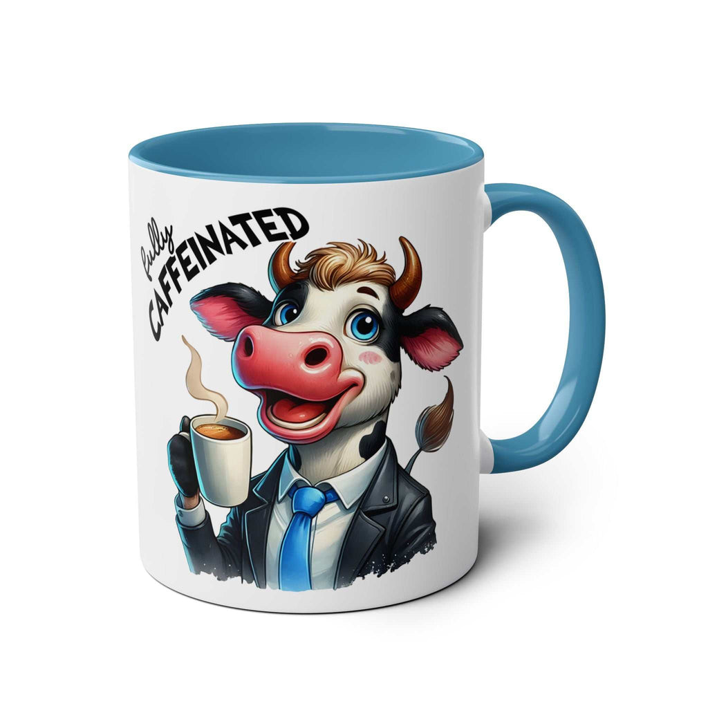 Fun Sarcastic Coffee Mug with cartoon cow design, blue handle, and text "Fully Caffeinated".
