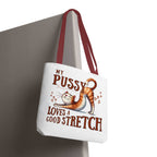 Fun stretching cat design on durable polyester tote bag with colorful handles