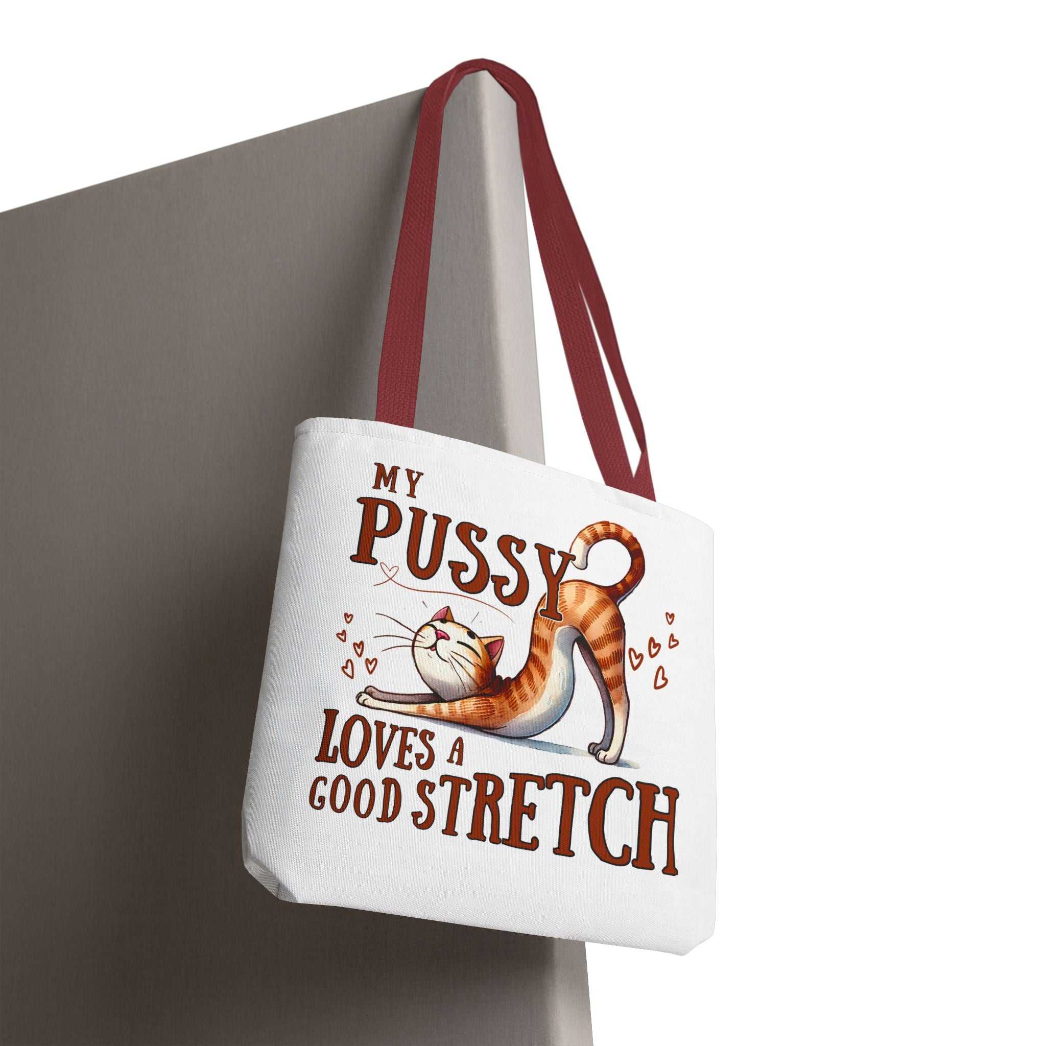 Fun stretching cat design on durable polyester tote bag with colorful handles