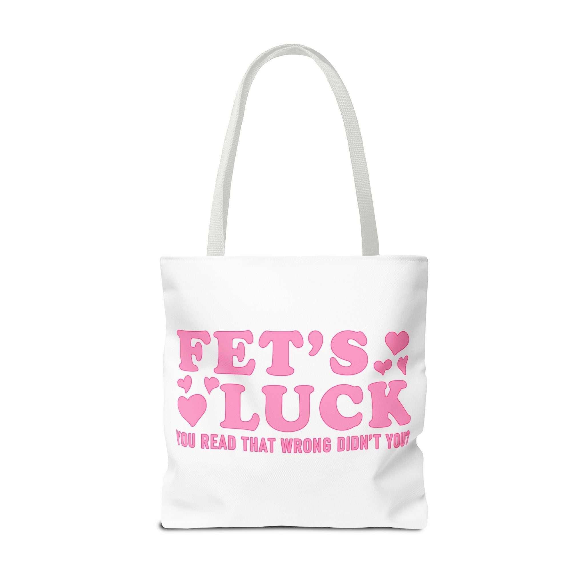 Pink heart tote bag with cheeky fun design and multiple handle color options, made from durable spun polyester.