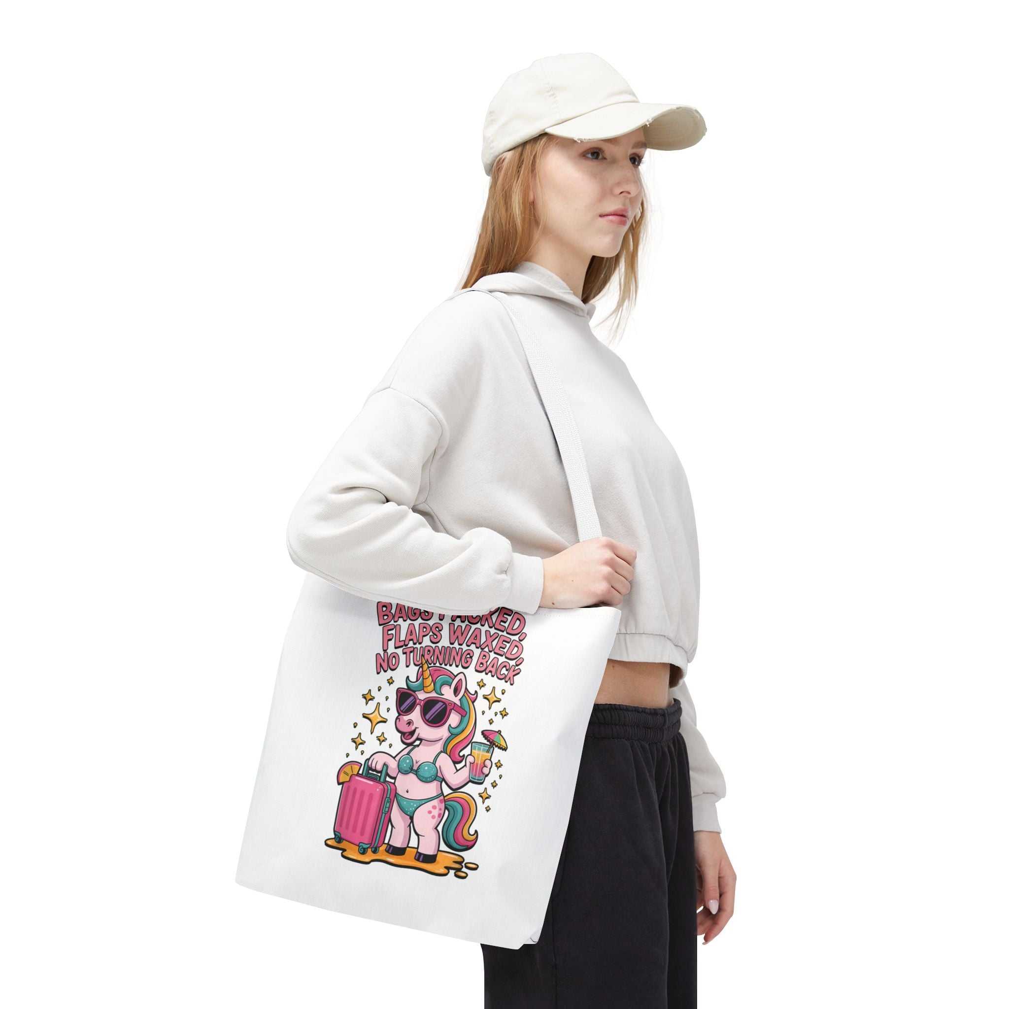 Fun unicorn travel tote bag with cheeky design, durable spun polyester, available in three sizes and multiple handle colors