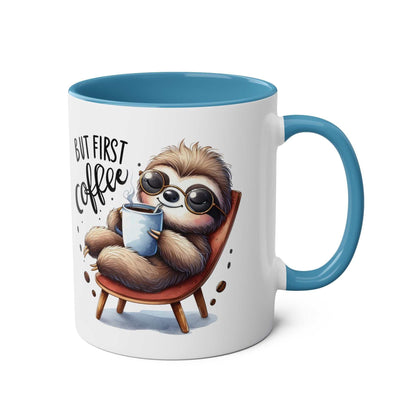 Cute sloth coffee mug with whimsical design and blue handle.