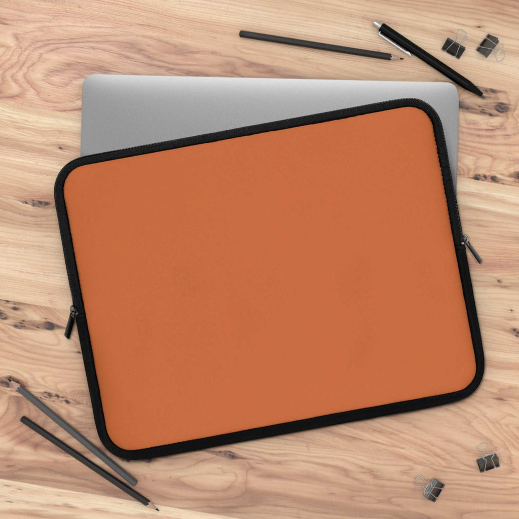 Bold orange neoprene laptop sleeve with black trim, dual zipper, and soft foam lining for protection.
