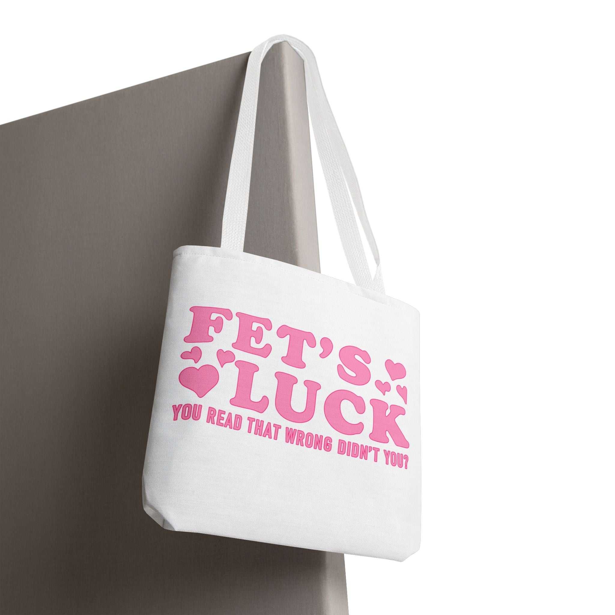 Pink heart tote bag with cheeky fun design and colorful handles, durable and reusable for errands or casual outings