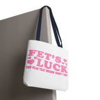 Pink heart tote bag with fun quote and colorful handles, made of durable spun polyester for everyday use