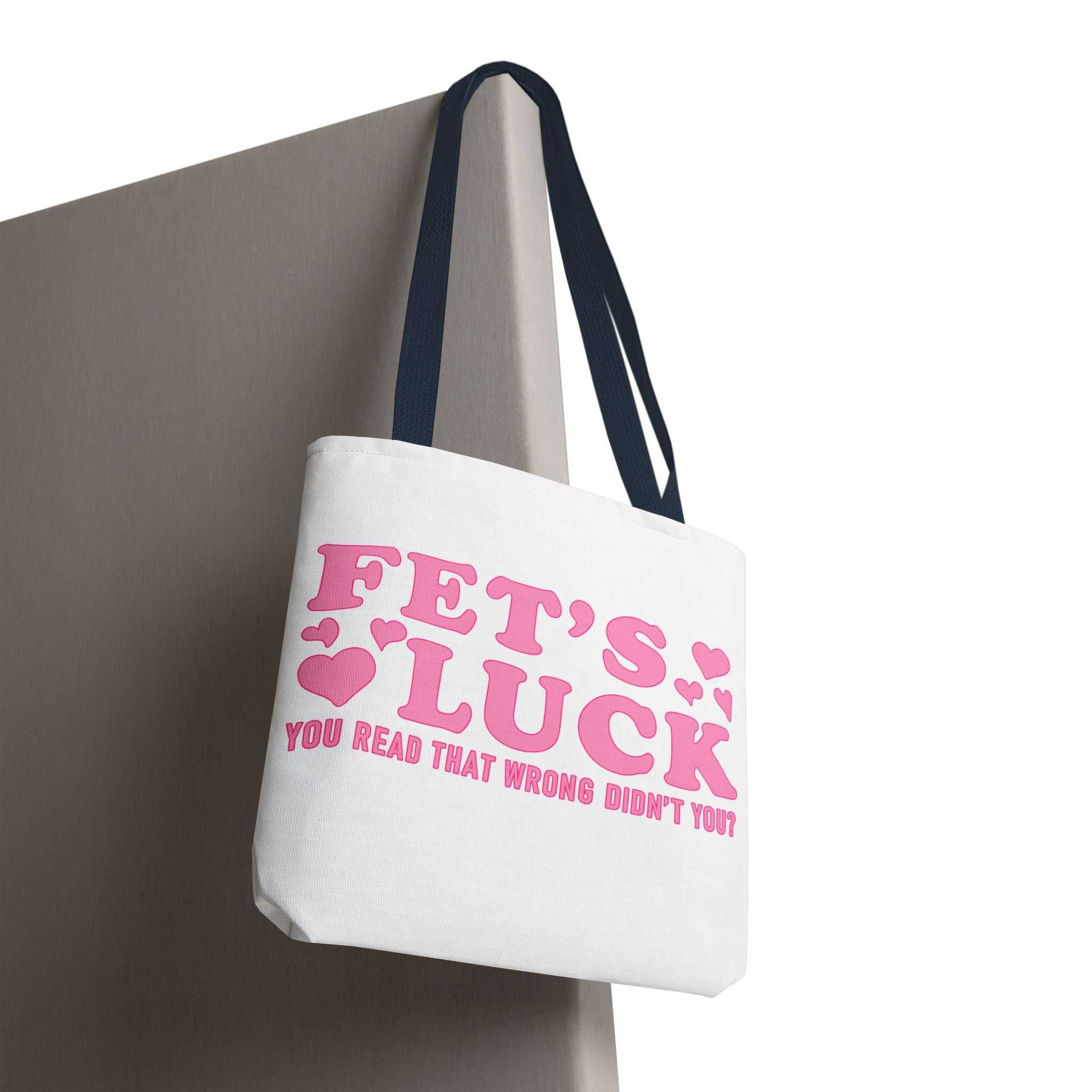 Pink heart tote bag with fun quote and colorful handles, made of durable spun polyester for everyday use