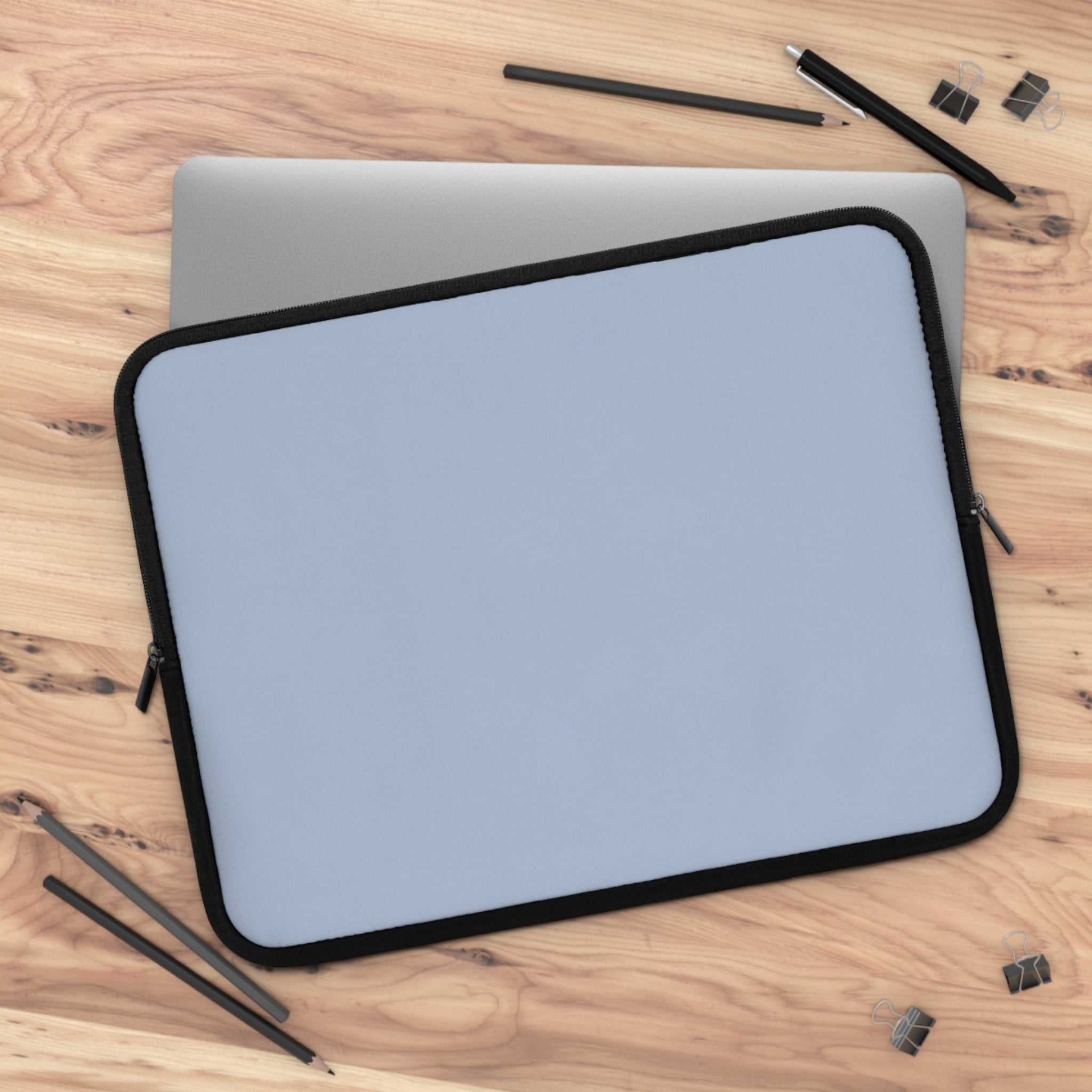 Misty Blue Laptop Sleeve made of durable neoprene with soft foam lining, dual zipper, lightweight and waterproof protection for laptops.