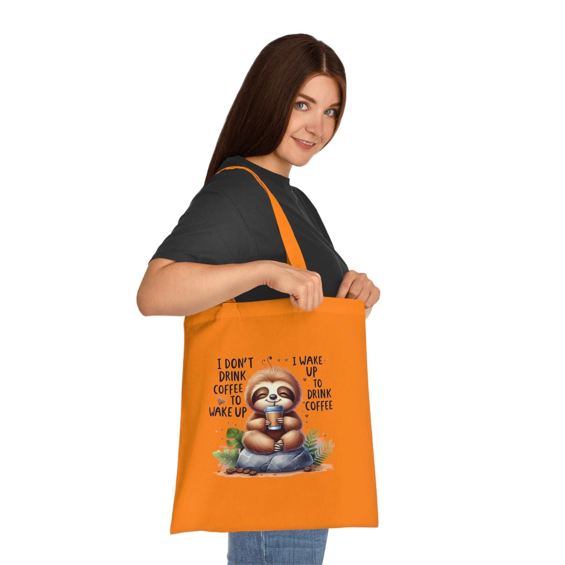 Cute sloth tote bag in vibrant colors, perfect for carrying essentials with style and fun.