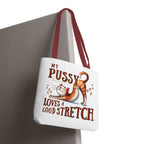 Fun stretching cat design on durable reusable tote bag with multiple handle color options