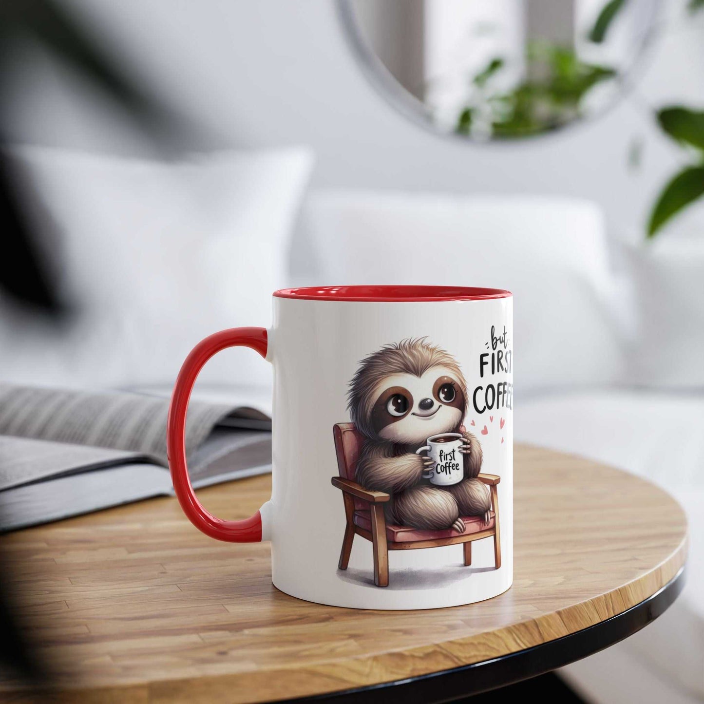 Cute sloth coffee mug with red handle on a wooden table in a cozy setting.