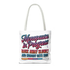 Menopause in Progress tote bag with cheeky design, durable polyester, multiple sizes, and handle color options