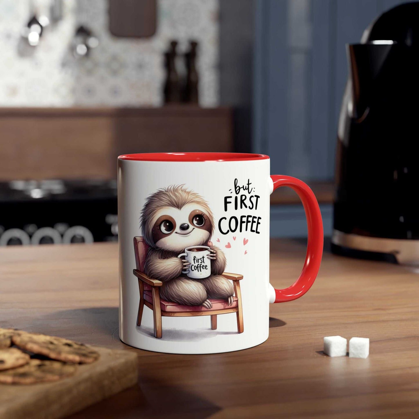 Cute sloth coffee mug with red handle sitting on a kitchen countertop.