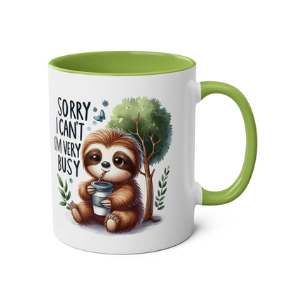 Cute sloth coffee mug with whimsical design and green interior handle.