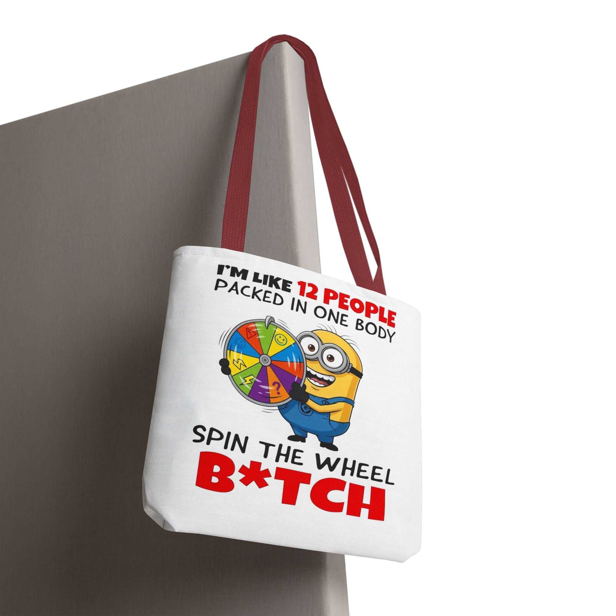 Funny Minion tote bag with cheeky design, durable spun polyester, and colorful handles for everyday use