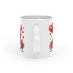 Cute Valentines Day mug with heart-shaped handle and vibrant design.