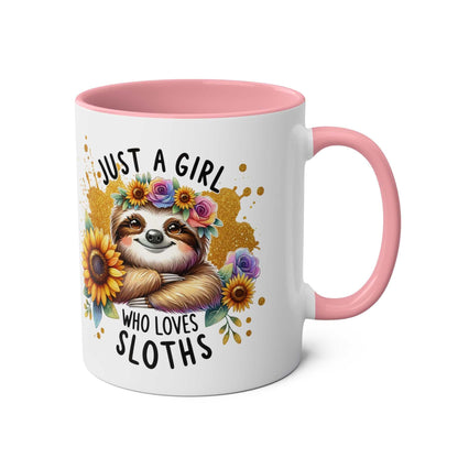 Cute sloth coffee mug with pink handle and floral design.