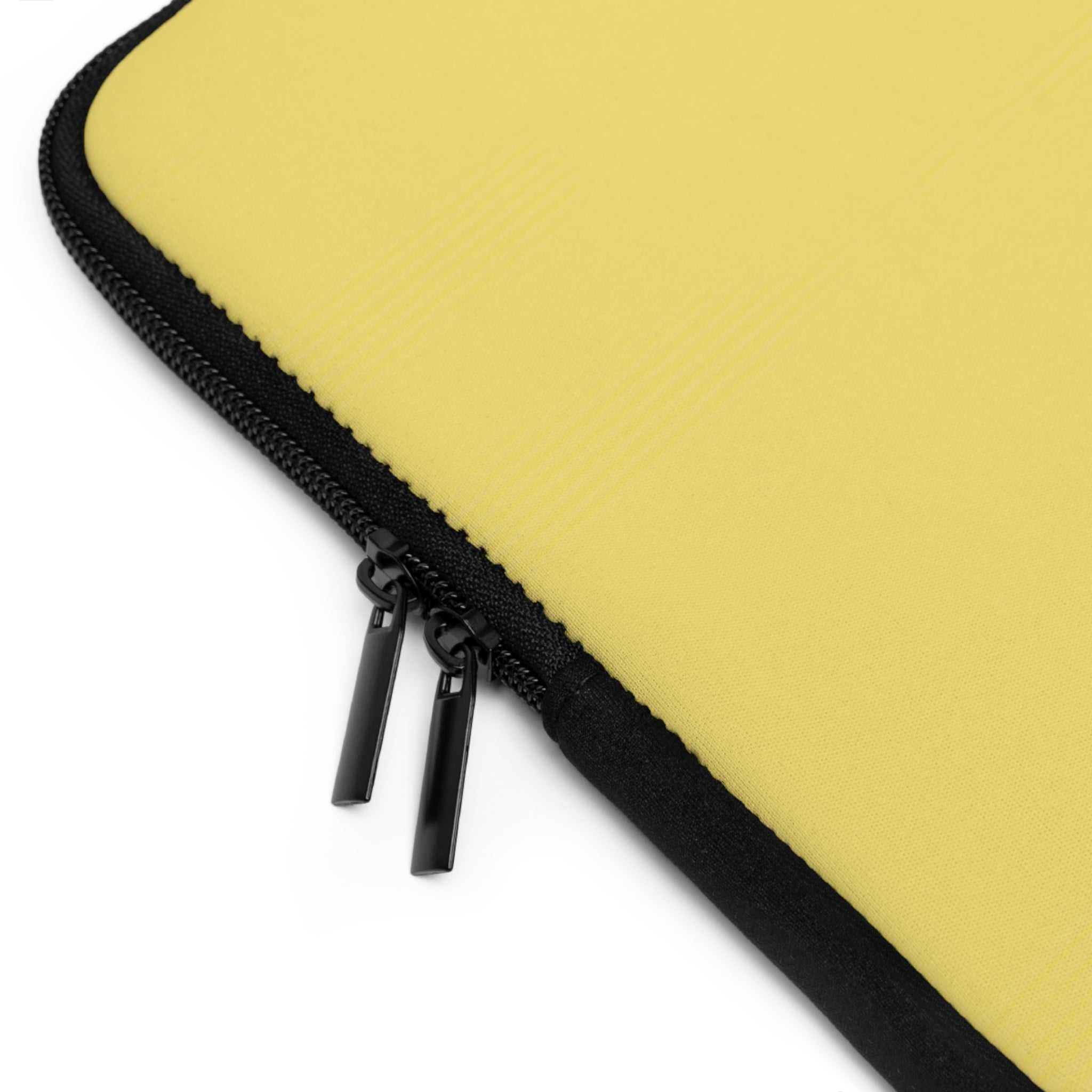 Close-up of lemon yellow neoprene laptop sleeve with black dual zipper and soft foam lining for protection