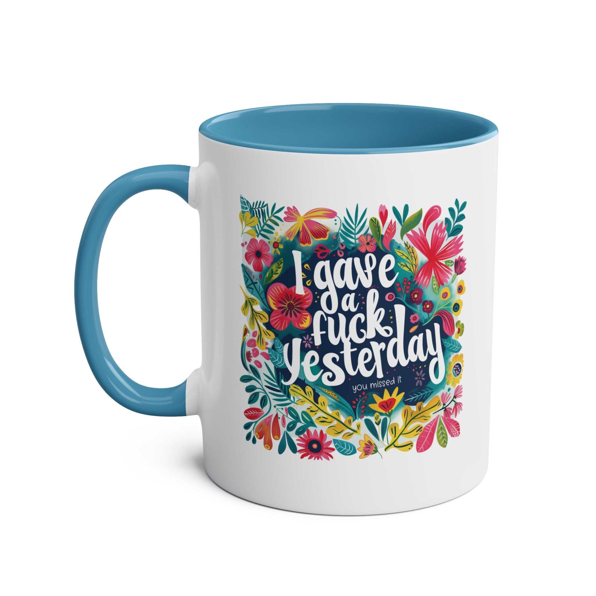 Cheerful "I Gave a Fuck Yesterday" coffee mug with colorful floral design and blue interior.