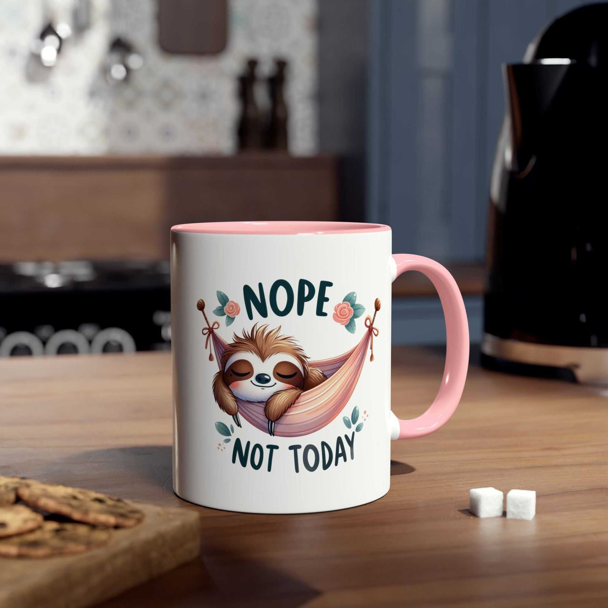 Cute sloth coffee mug with "Nope Not Today" design in kitchen setting.