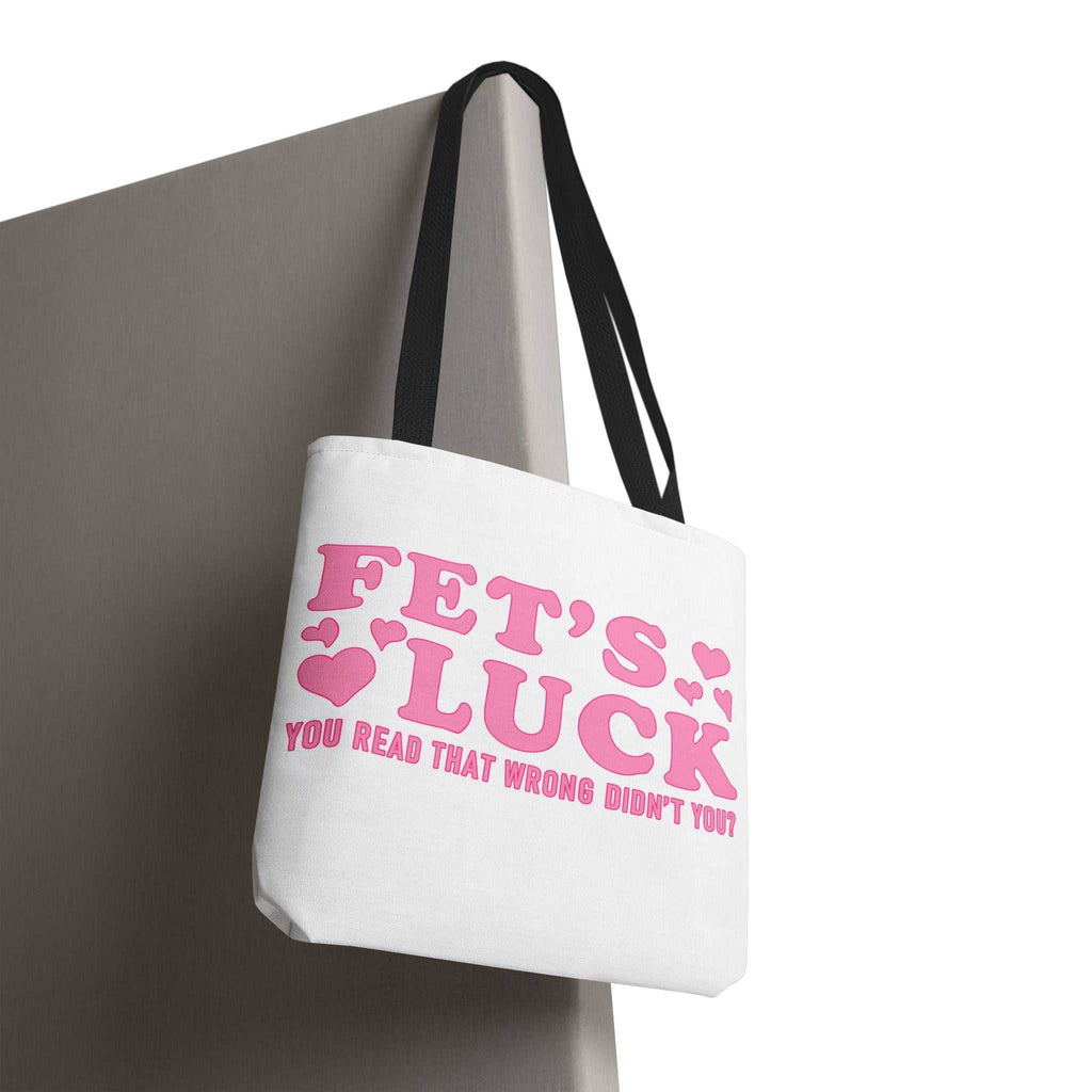 Pink heart tote bag with fun cheeky design and multiple handle color options