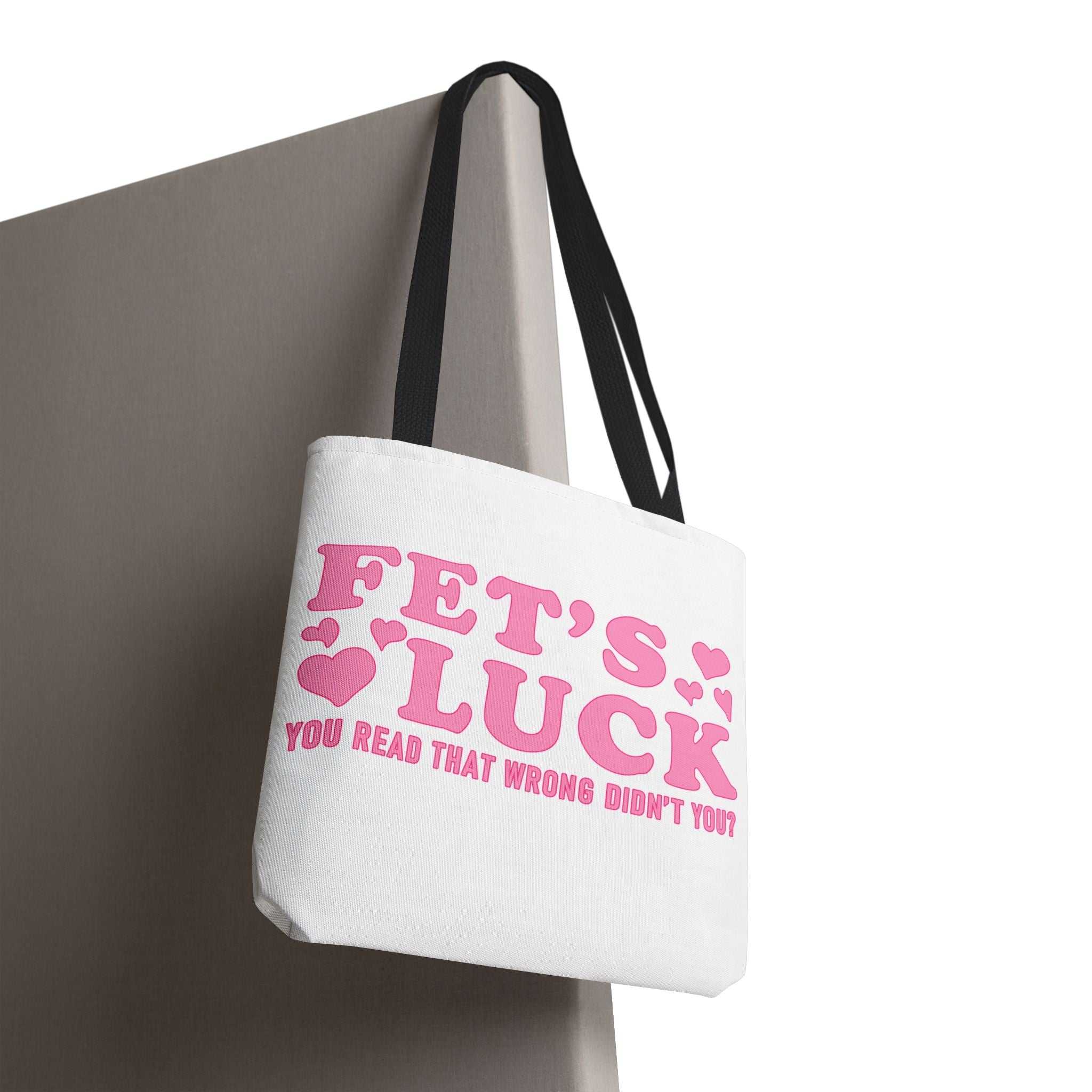Pink heart tote bag with fun cheeky design and multiple handle color options